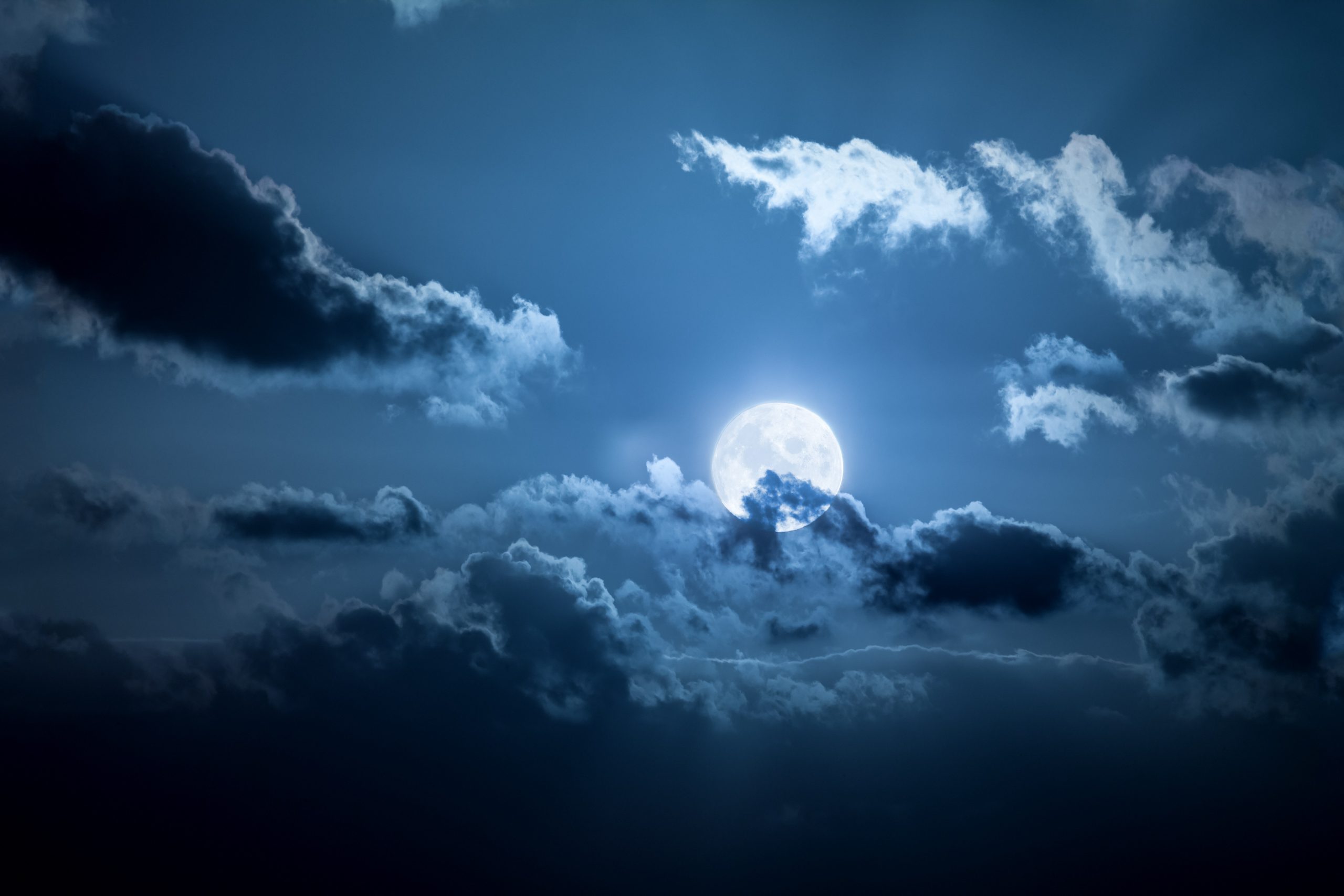 eerie moon through clouds