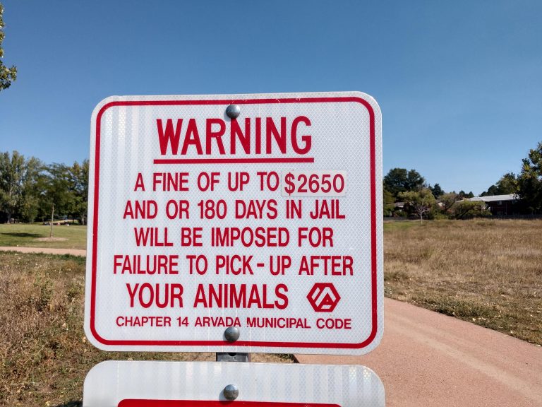 Warning-failure to pick up after your pet sign in park