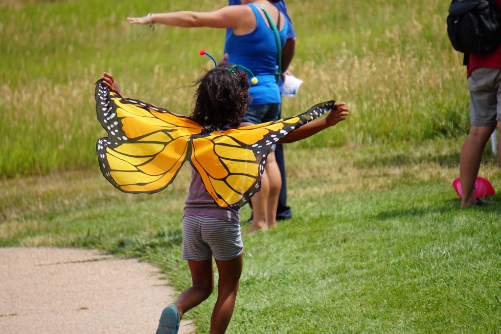 child with monarch wings