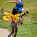 child with monarch wings